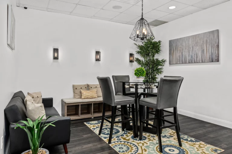 Eating area with four-person dining table in a sleek, modern design at Legacy Healing Center’s Cherry Hill drug and alcohol rehab center