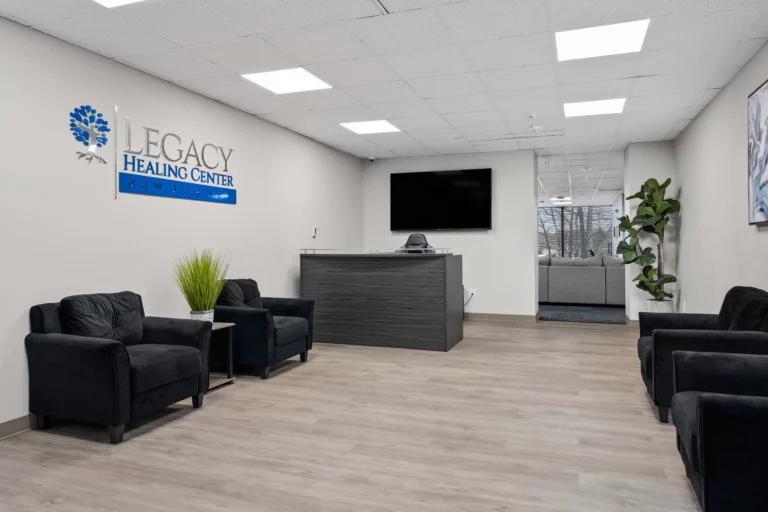 Reception area with dark grey, modern aesthetic at Legacy Healing Center’s Cherry Hill drug and alcohol rehab center